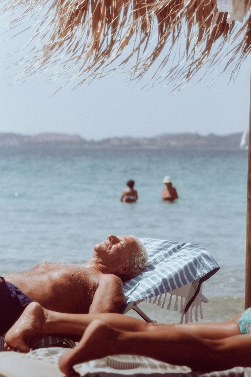 a person lying on a beach