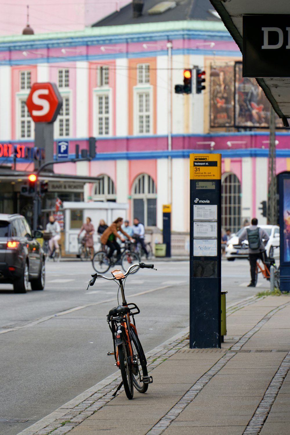 a bicycle is parked on the side of a street