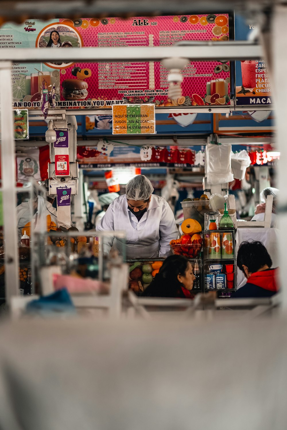 a person in a white coat in a store