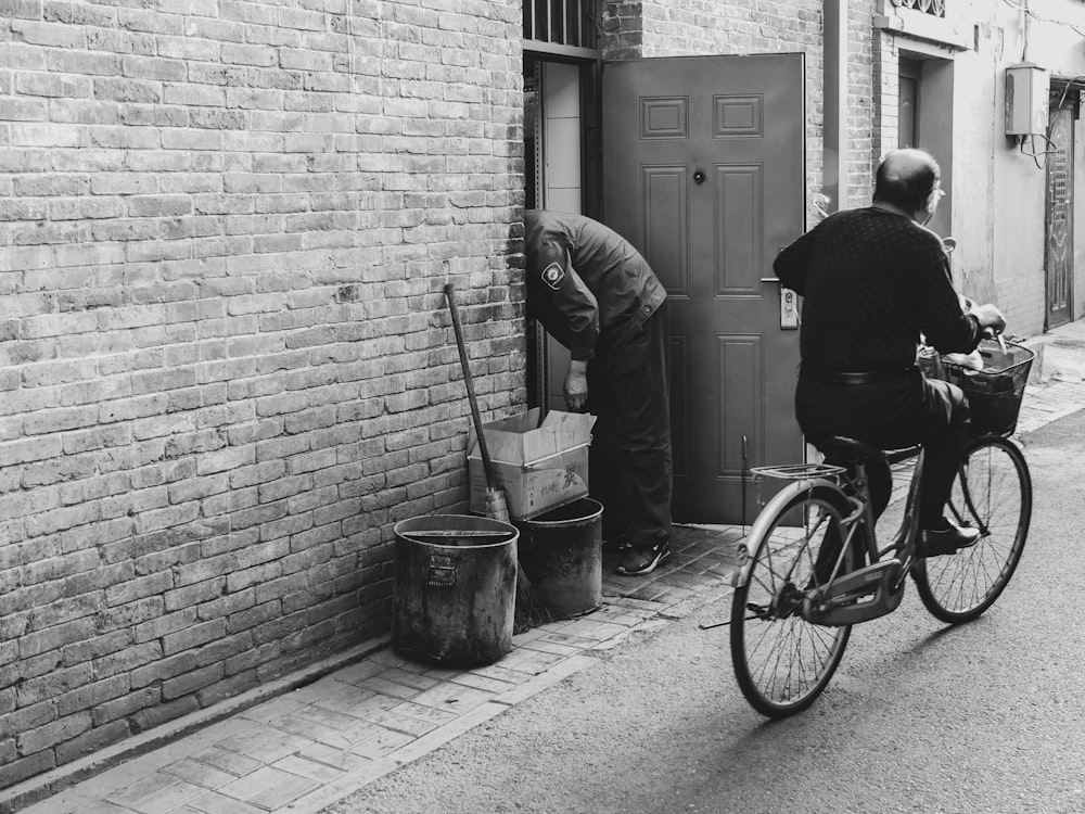 a person on a bicycle next to a person on a bicycle