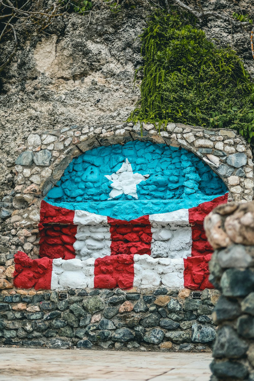 a flag painted on a stone wall