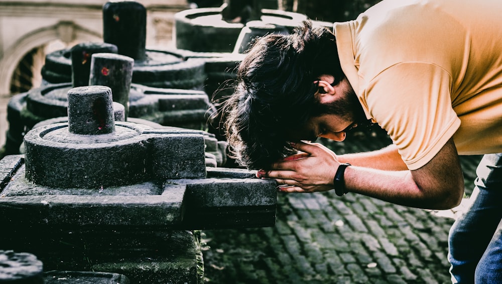 a person looking at a stack of bricks