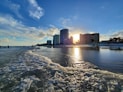 a beach with buildings in the background