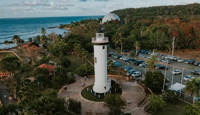 a white tower near a beach