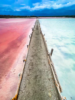 a long concrete wall with a red line on the side