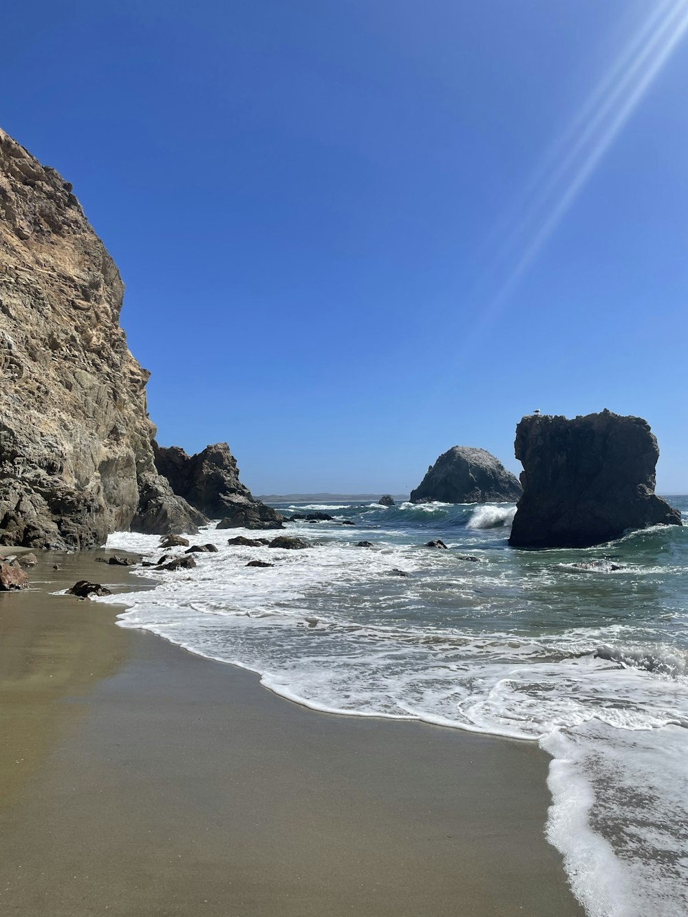 a beach with rocks and water