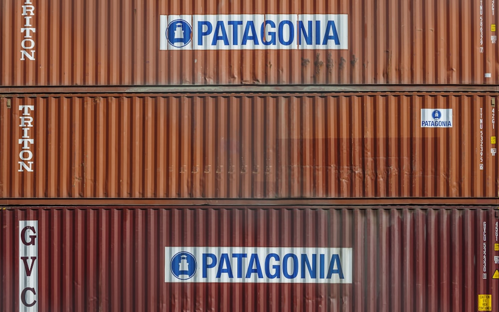 a wood wall with signs on it