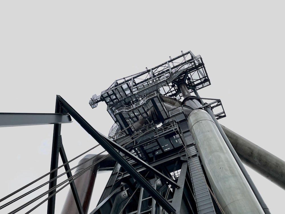 a roller coaster with a cloudy sky