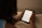 A person reading an e-book on a tablet in a cozy setting.