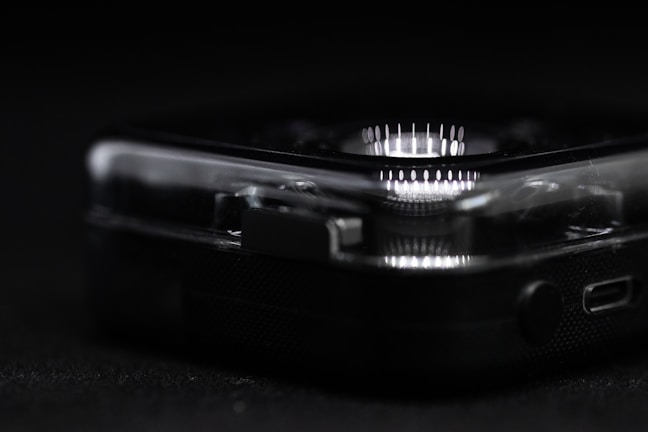 Close-up of a sleek prototype device with glowing circuit patterns.