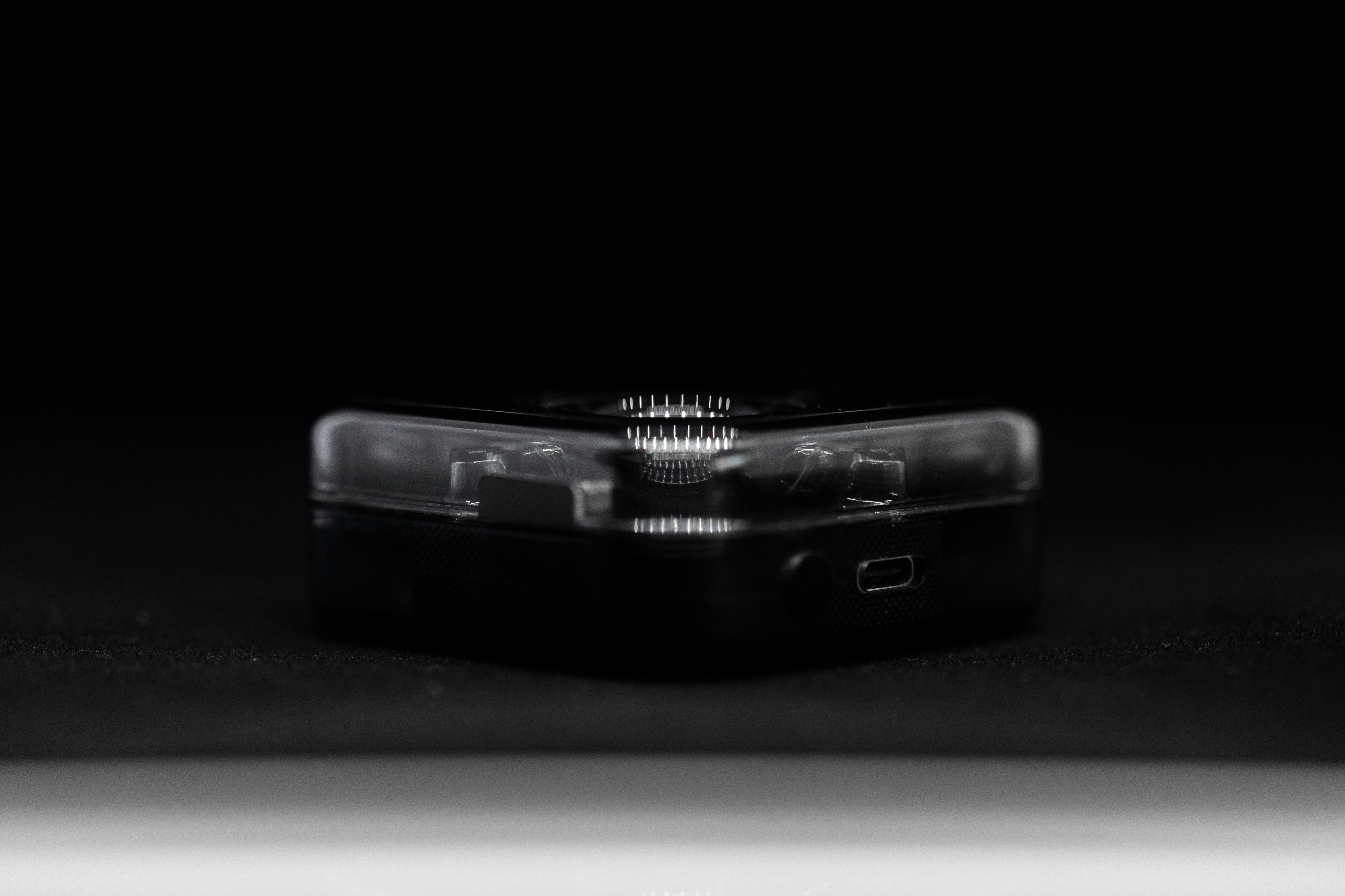 a black rectangular object with a light on it