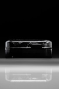 Futuristic smart device seamlessly integrating with a digital network in a dark, minimalist setting.