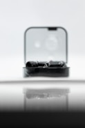 A sleek modern gadget displayed on a wooden table.