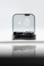 A sleek acrylic case with certification badges displayed beside it.