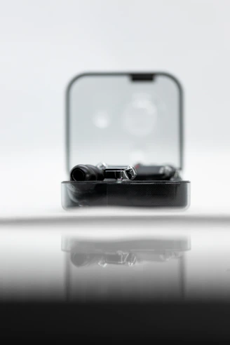 A neatly arranged product card showing a sleek gadget on a minimalist background.