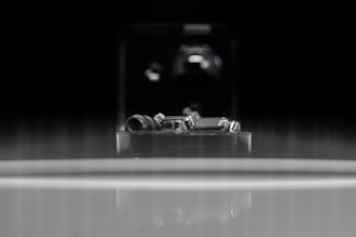 Close-up of finely finished metal components arranged neatly on a workshop table.