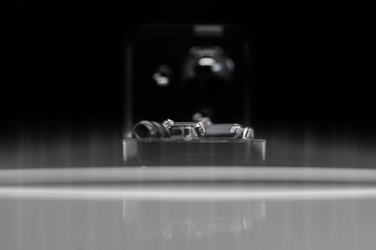 Close-up of finely finished metal components arranged neatly on a workshop table.