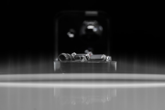 A close-up of finely crafted brass components arranged neatly on a workshop table.