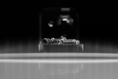 A close-up of precision metal components on a workbench.