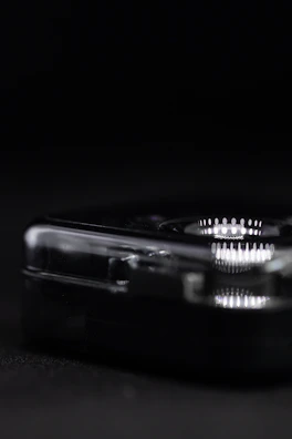 Close-up of a custom acrylic support with polished edges and a glossy finish.