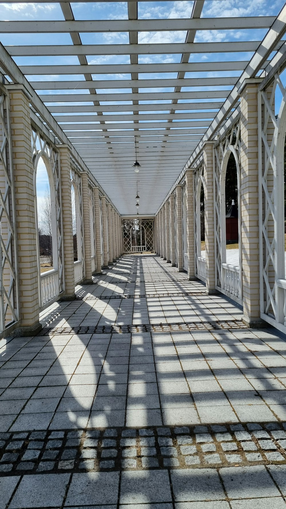 a walkway with a glass roof