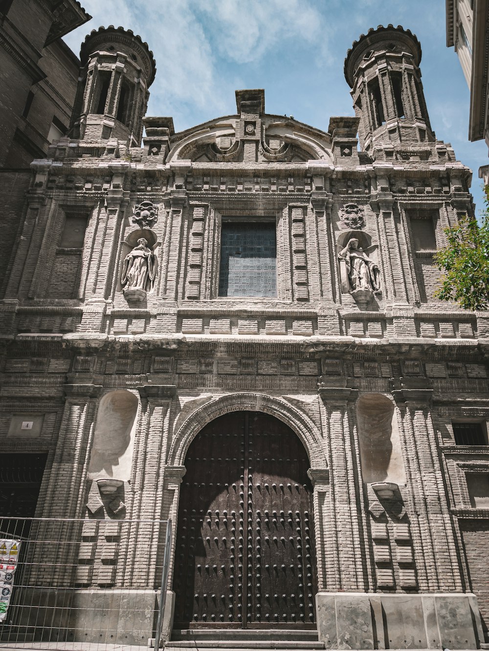 a building with statues on the front