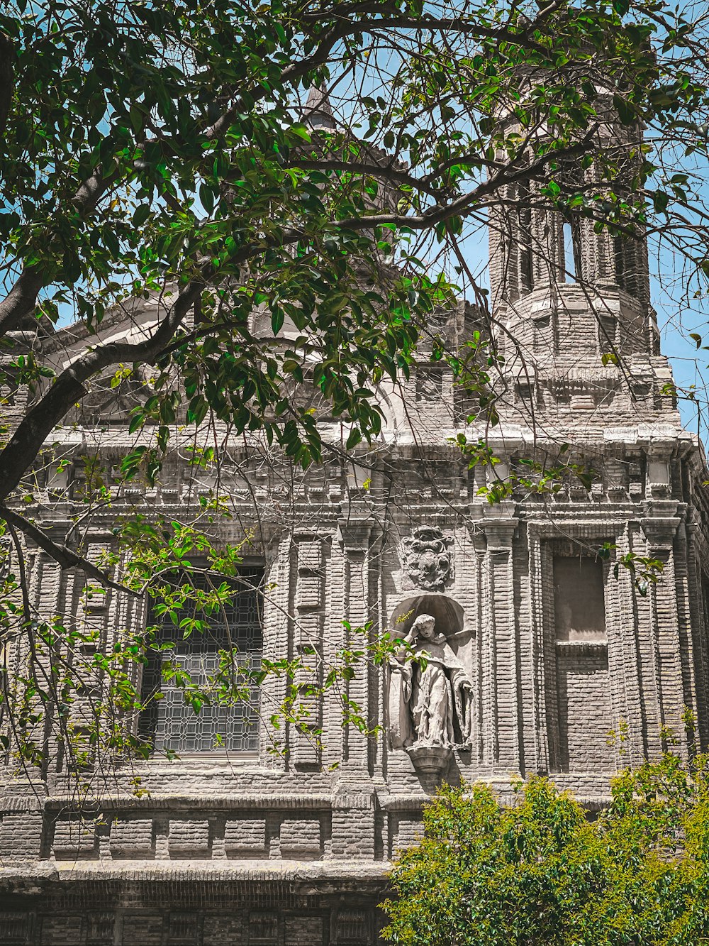 a statue in front of a building