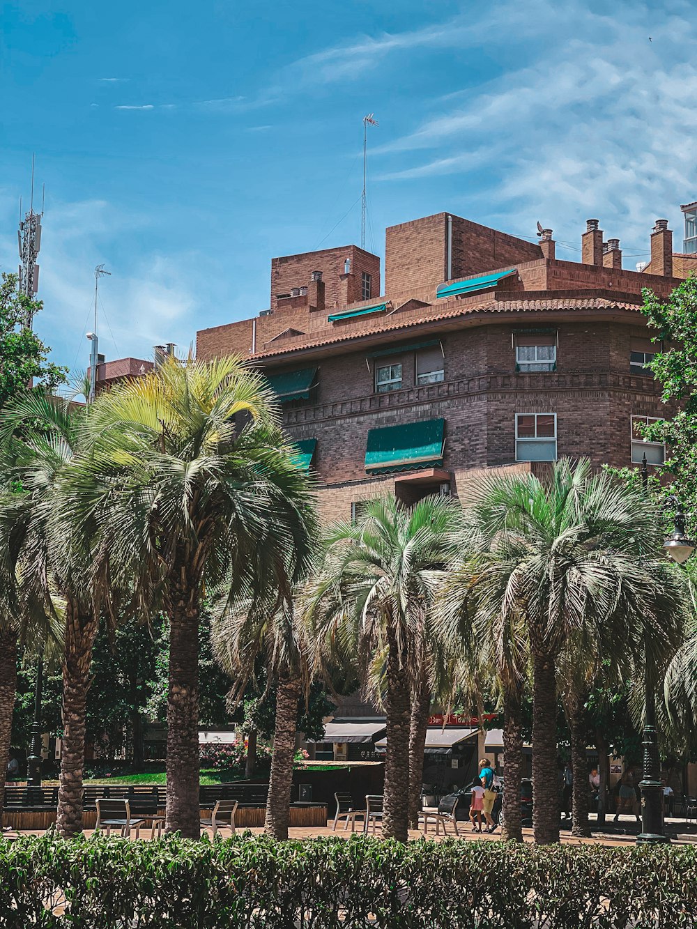 a building with palm trees in front of it