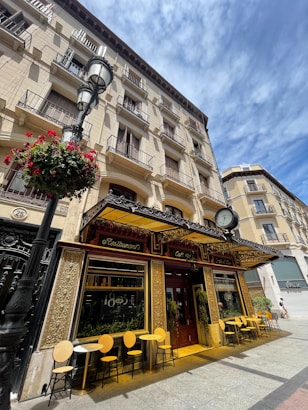 a building with tables and chairs outside