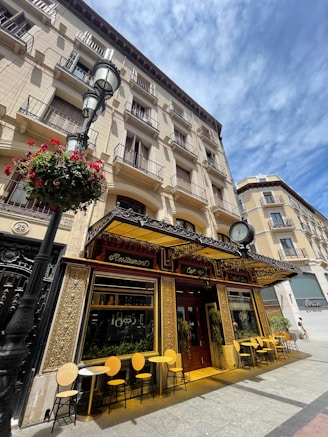 a building with tables and chairs outside