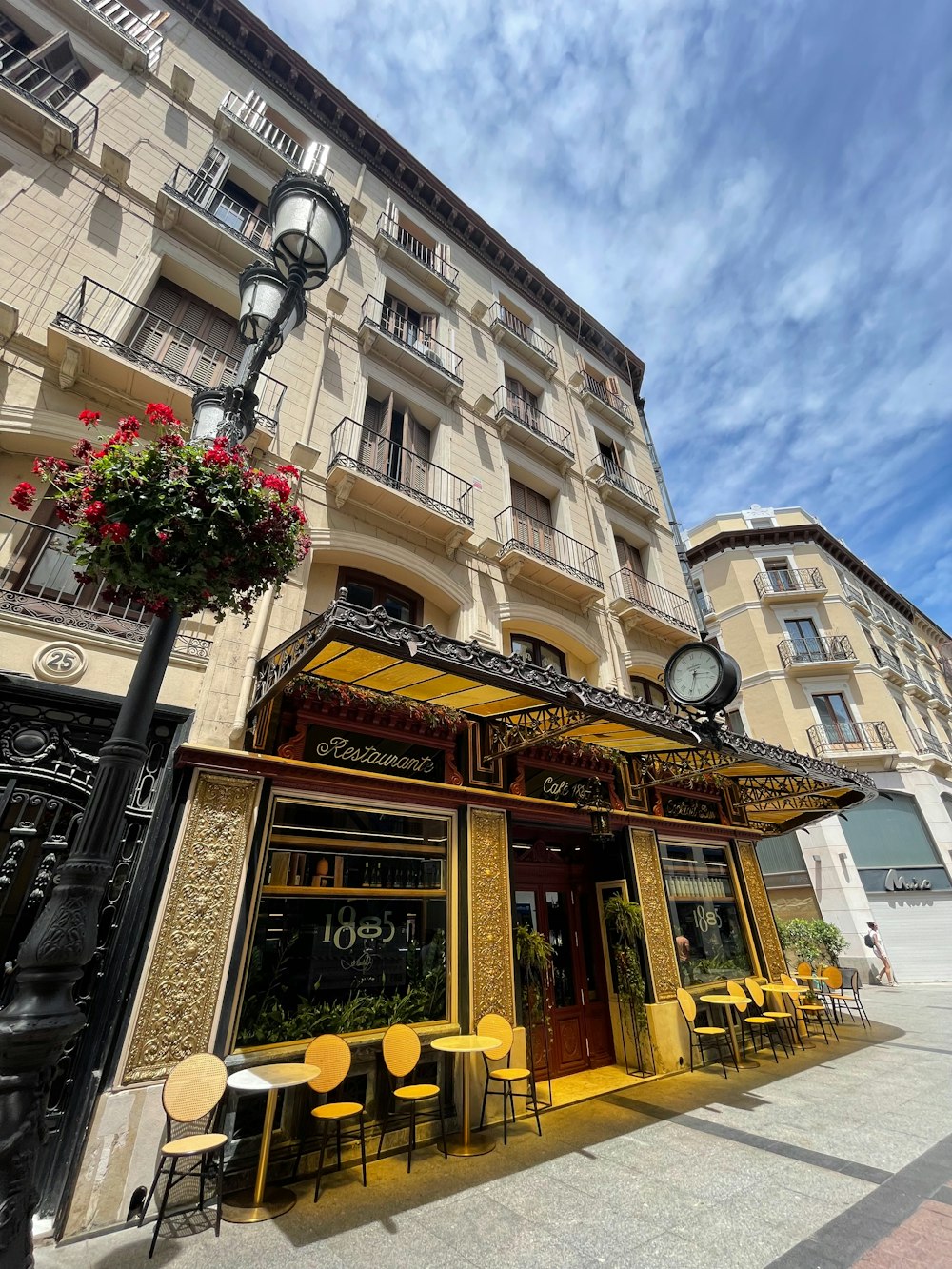 a building with tables and chairs outside