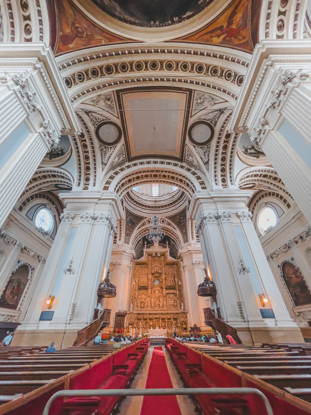 a large ornate church with a large stained glass window