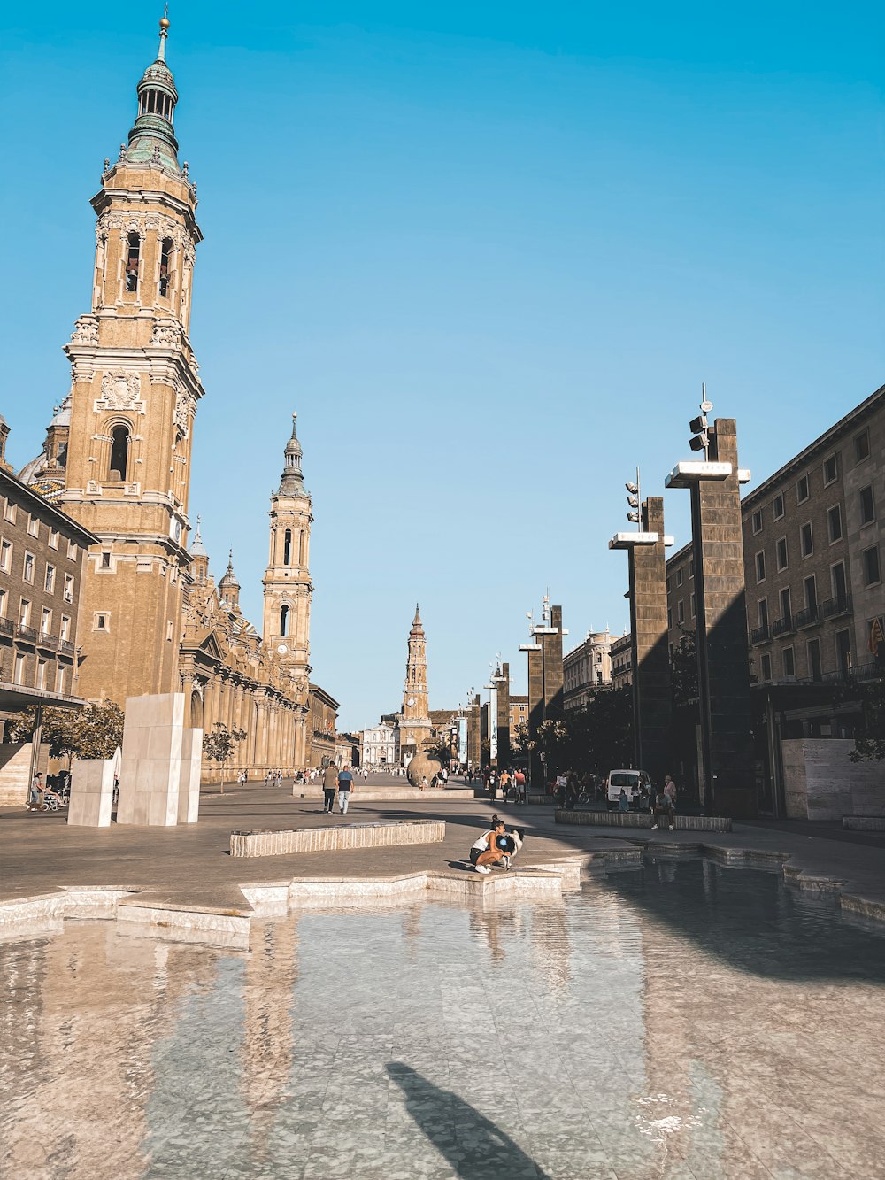 a large stone courtyard with towers