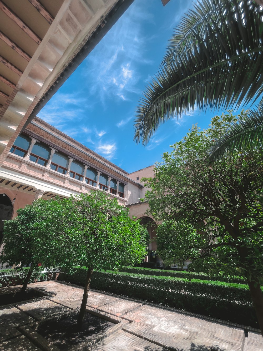 a building with trees and grass