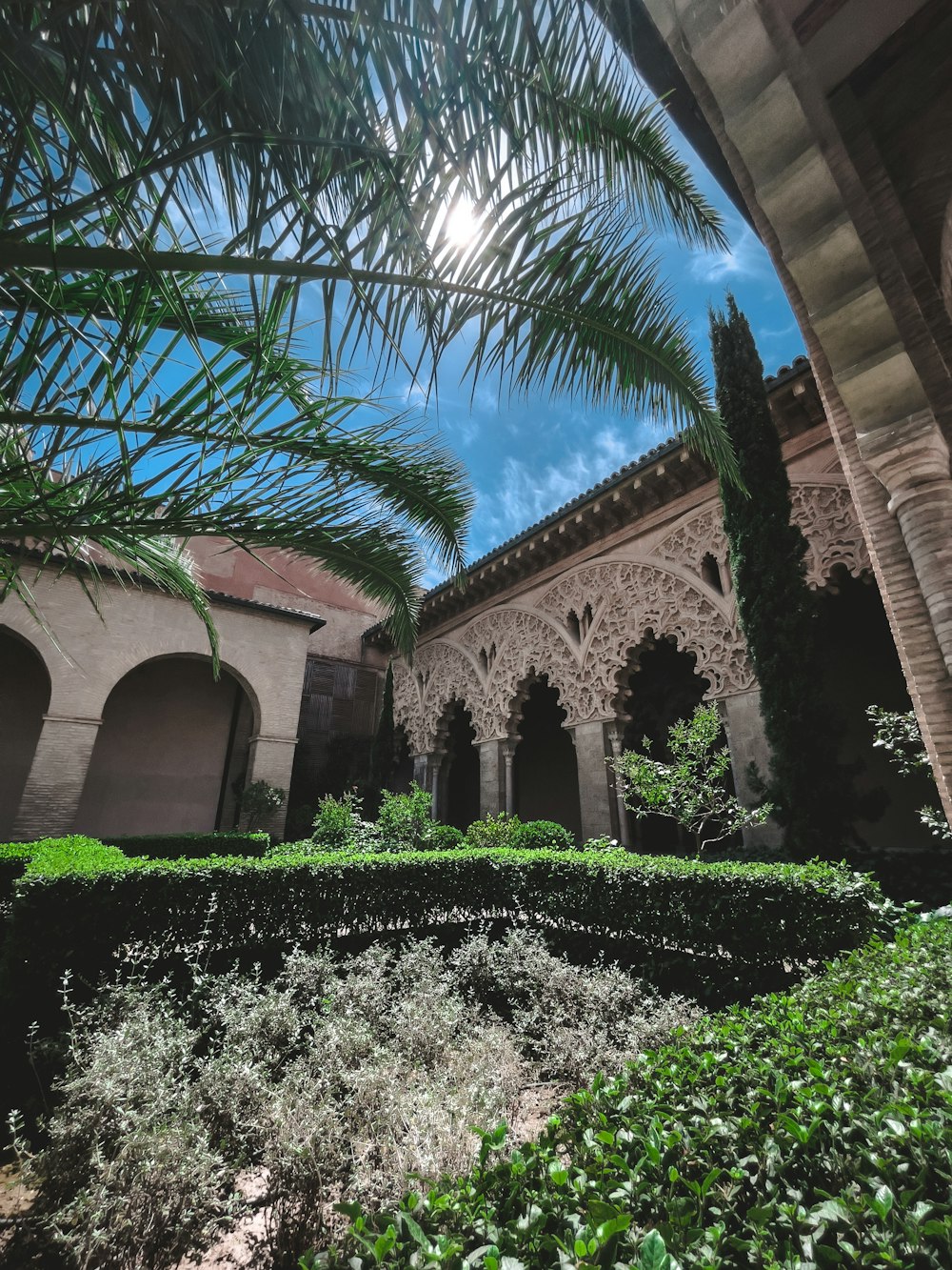 a large stone building with a large glass ceiling