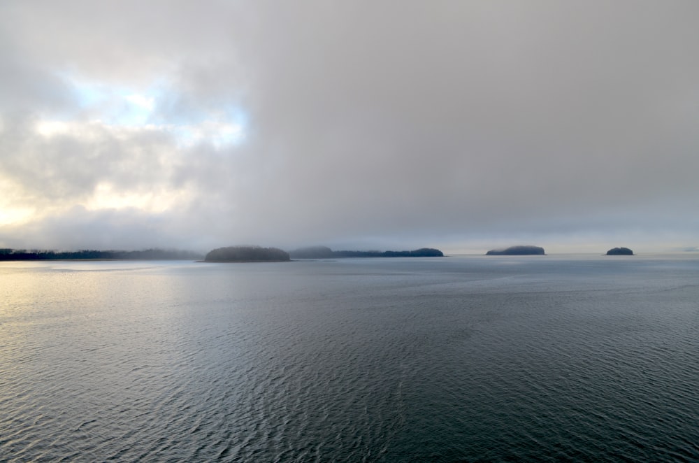 a body of water with land in the distance