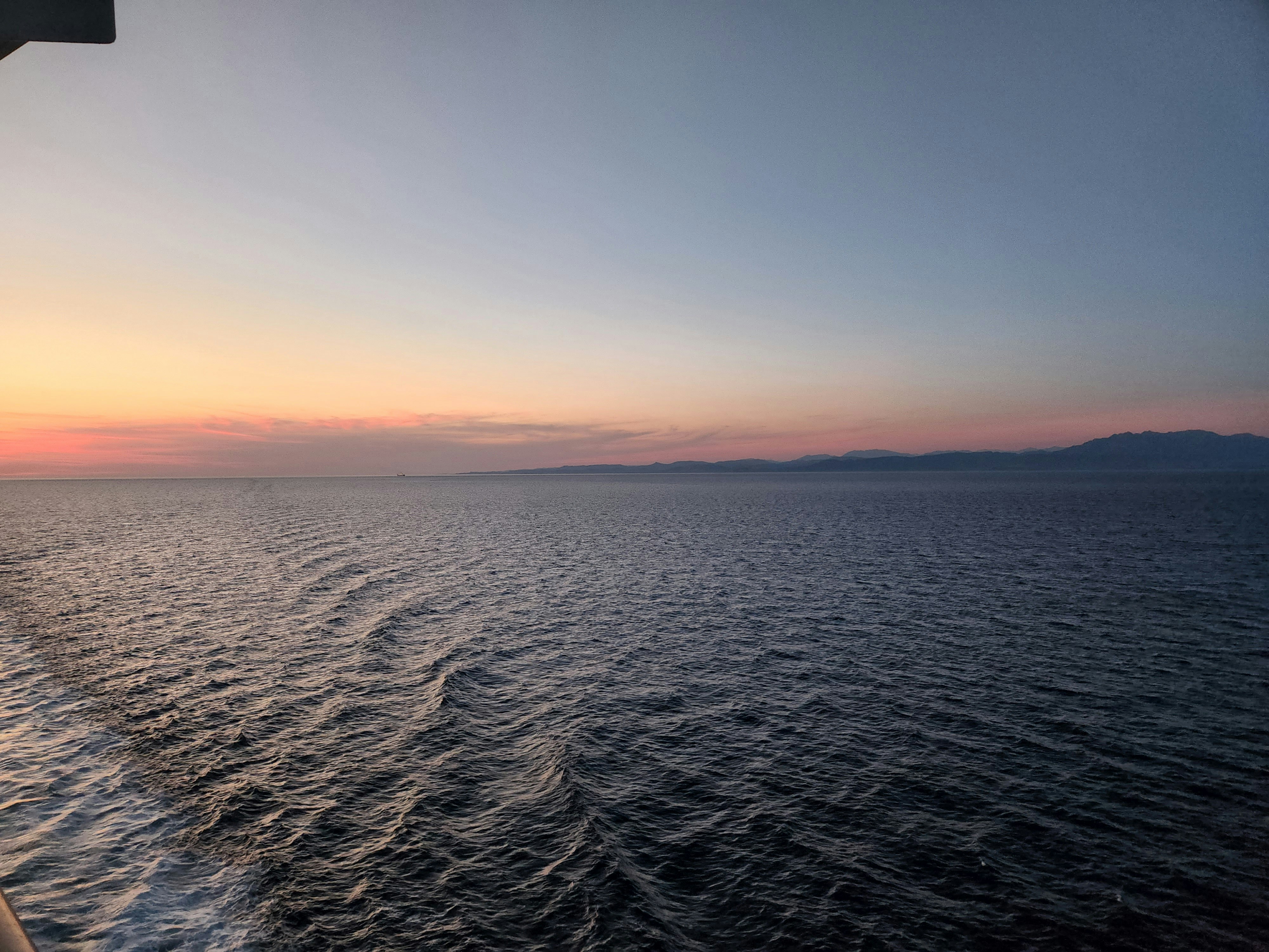 a body of water with a sunset