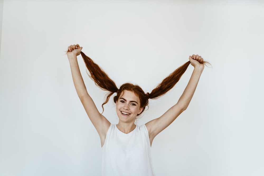 a woman with her arms up