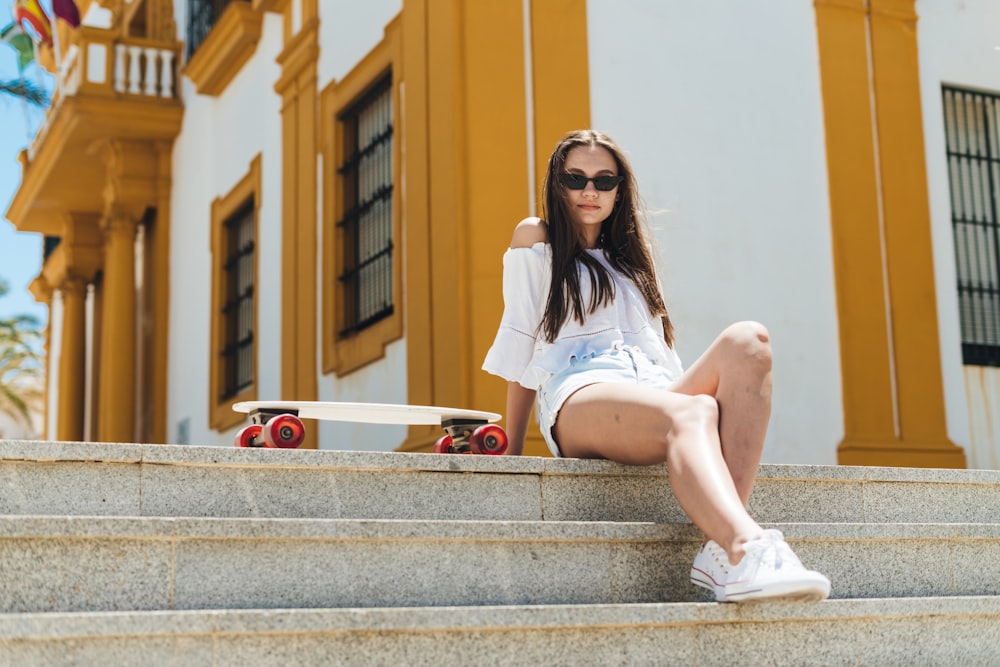 a woman sitting on stairs