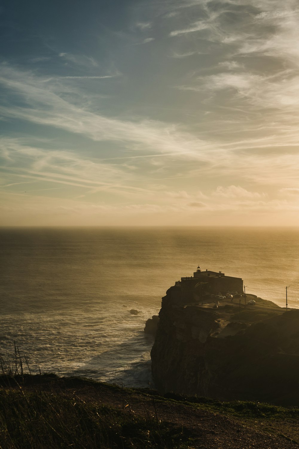 a cliff next to the ocean