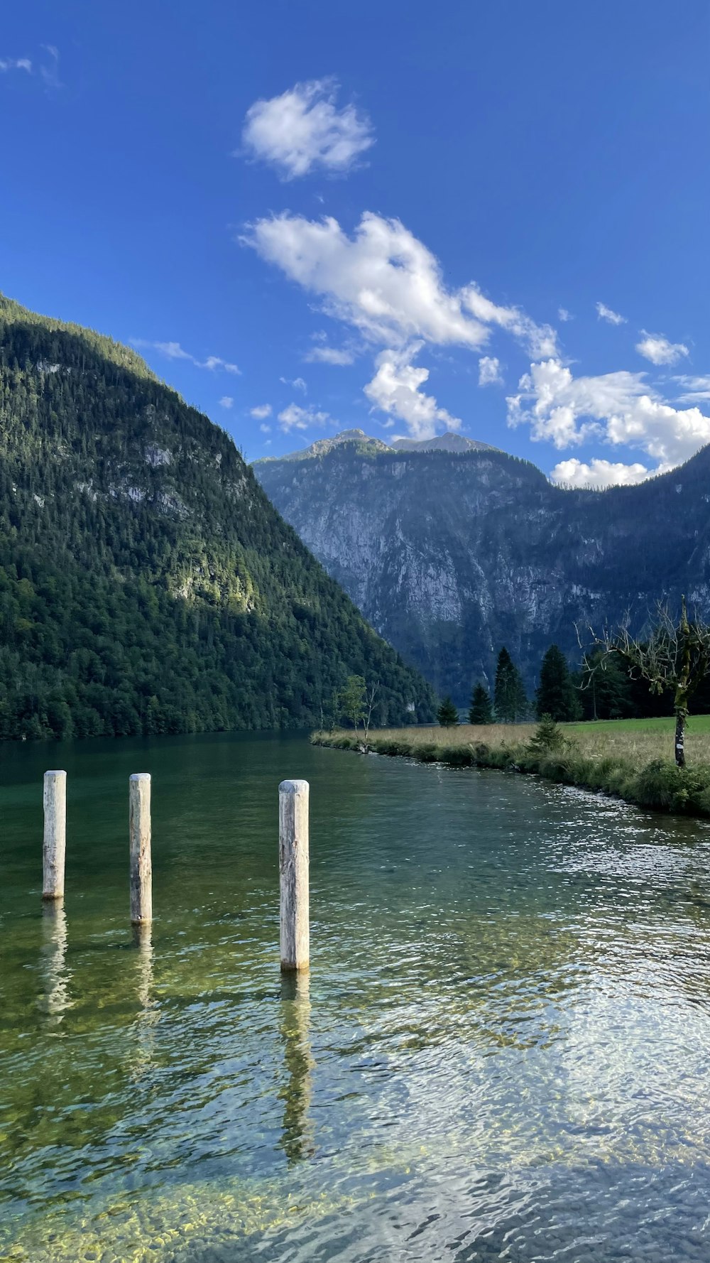 a body of water with mountains in the background