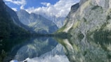 A tranquil lake surrounded by mountains, representing calmness.