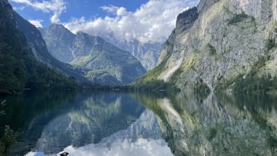 A tranquil lake surrounded by mountains, representing calmness.