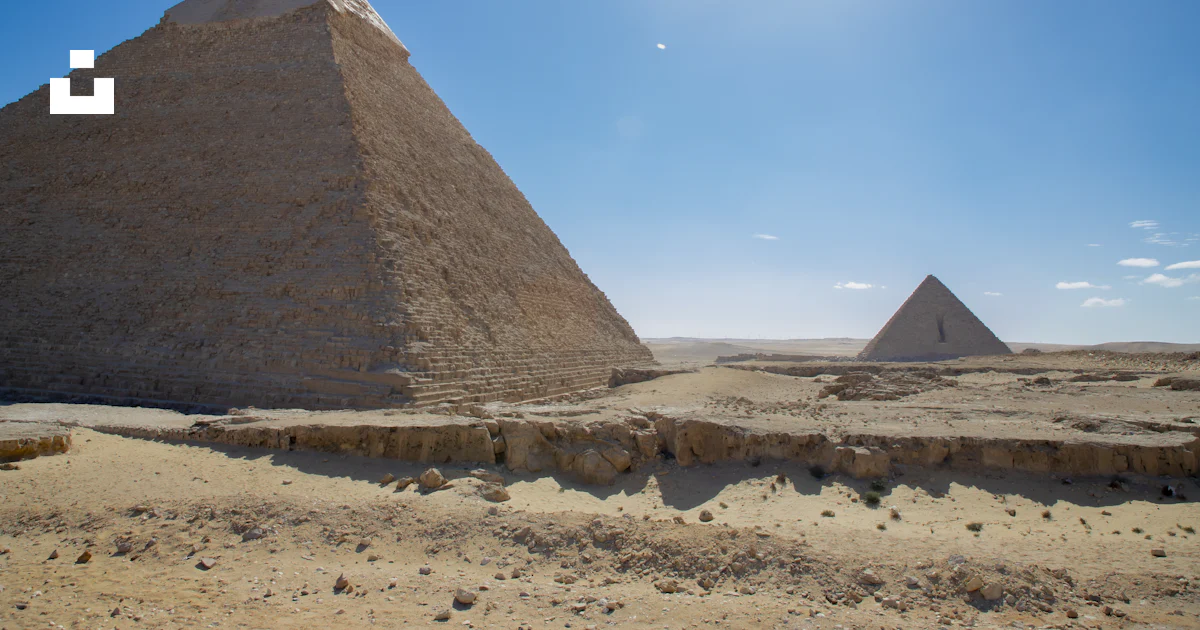 A group of pyramids in a desert photo – Free Pyramid of giza Image on ...