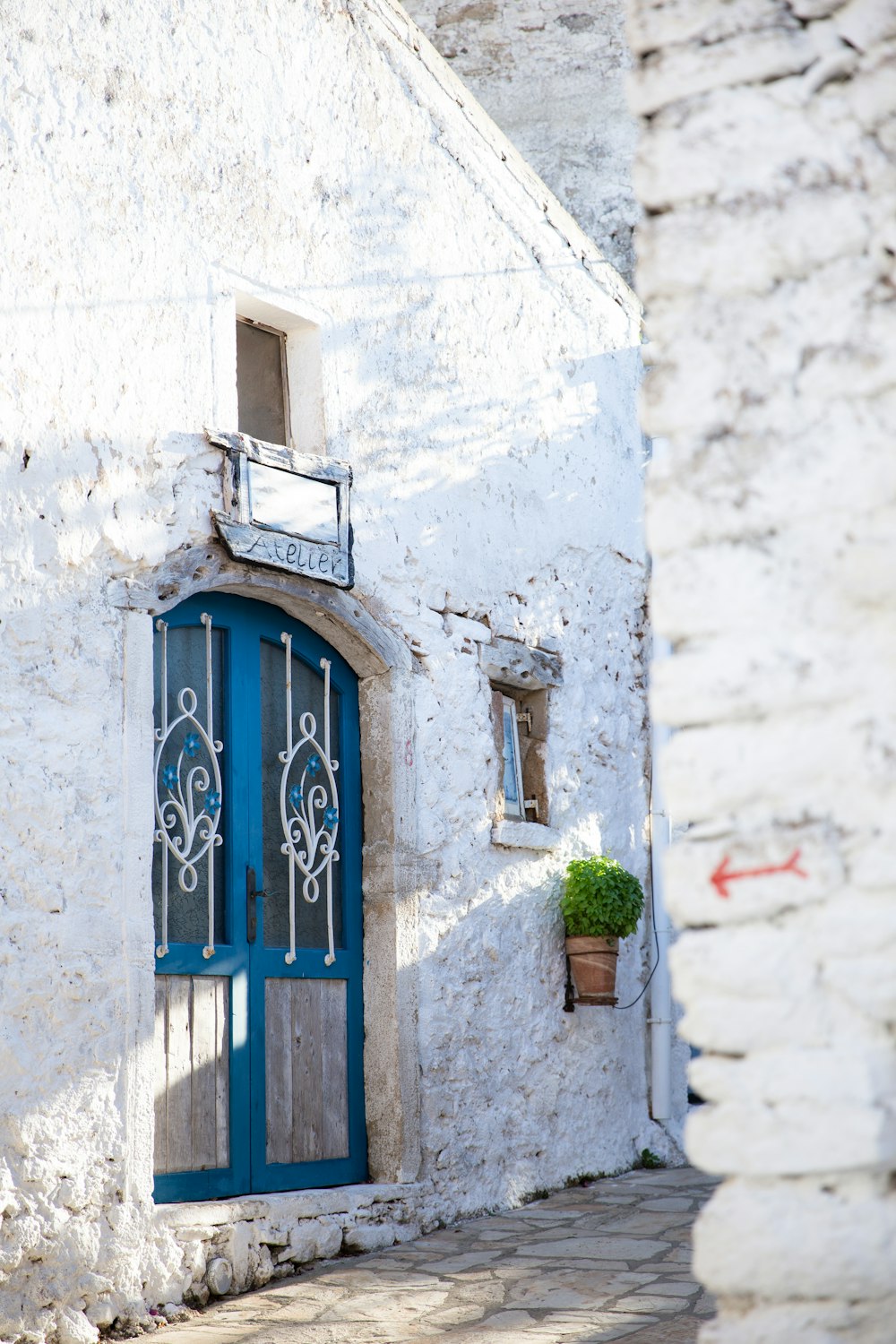 a blue door on a white building