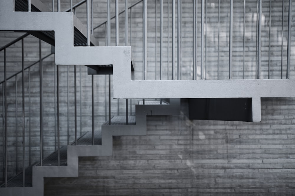 a set of stairs leading up to a glass wall