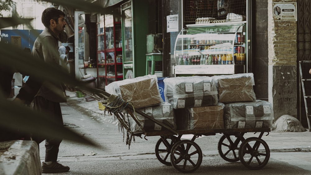 a person pushing a cart full of bags