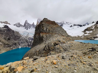 a rocky mountain with snow