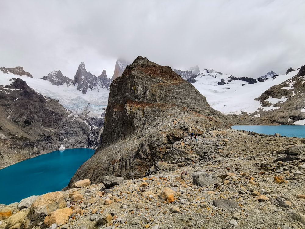 a rocky mountain with snow