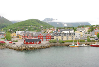 a body of water with boats and buildings along it